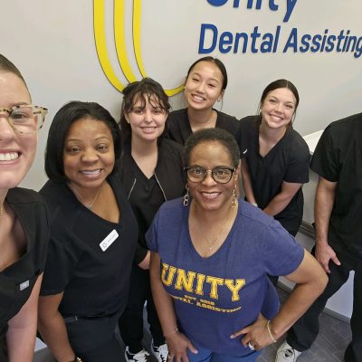 Photo of Unity Dental Assisting students during class at our Dental Assistant School.
