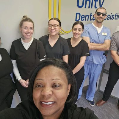 Photo of Unity Dental Assisting students during class at our Dental Assistant School.